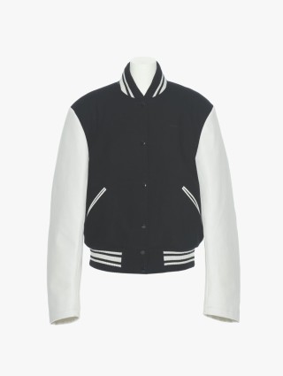 Черная куртка PUSHBUTTON с контрастными рукавами: фото - Invogue