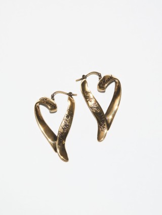 Золотисті сережки Acne Studios у формі сердець: фото - Invogue