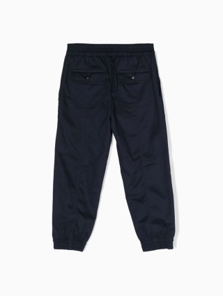 Синие брюки EMPORIO ARMANI с металлической эмблемой: фото 1 - Invogue